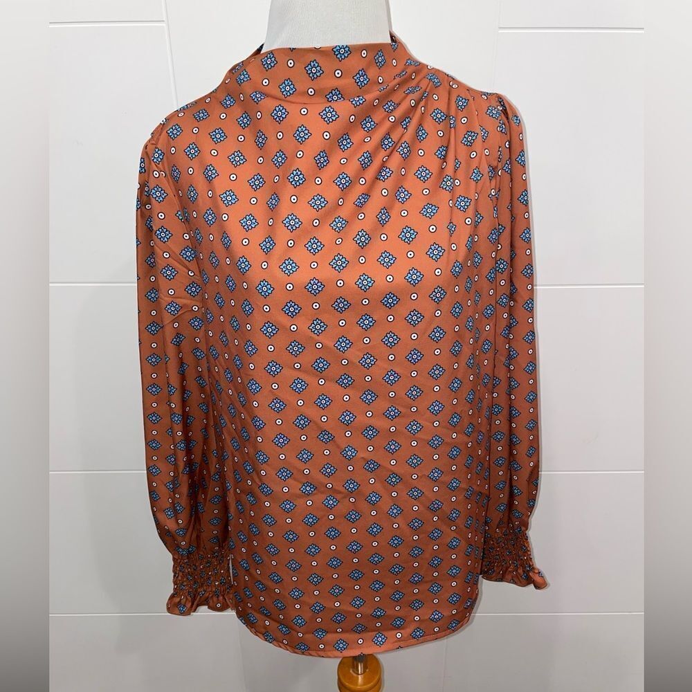 High neck, copper colored blouse